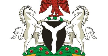 Nigeria's coat of arms features a black shield with a white, wavy pall that represents the confluence of the Niger and Benue Rivers in the city of Lokoja.