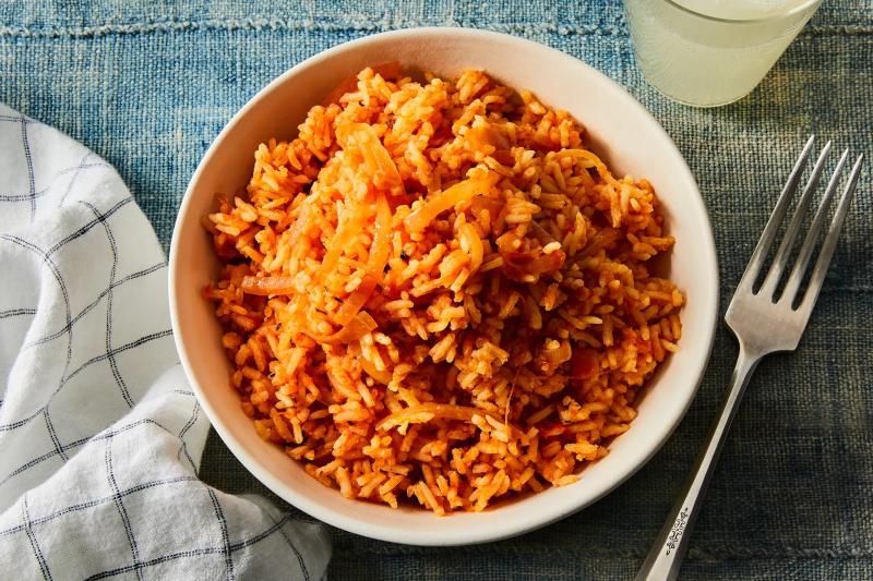 The rice dish known as jollof originates in West Africa. The dish is typically prepared in a pot with long-grain rice, spices, tomatoes, onions, meat, and vegetables. Both ingredients and methods of preparation are subject to regional variation.