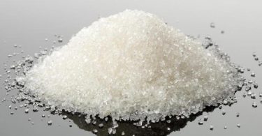 pile-of-white-granules-on-reflective-surface